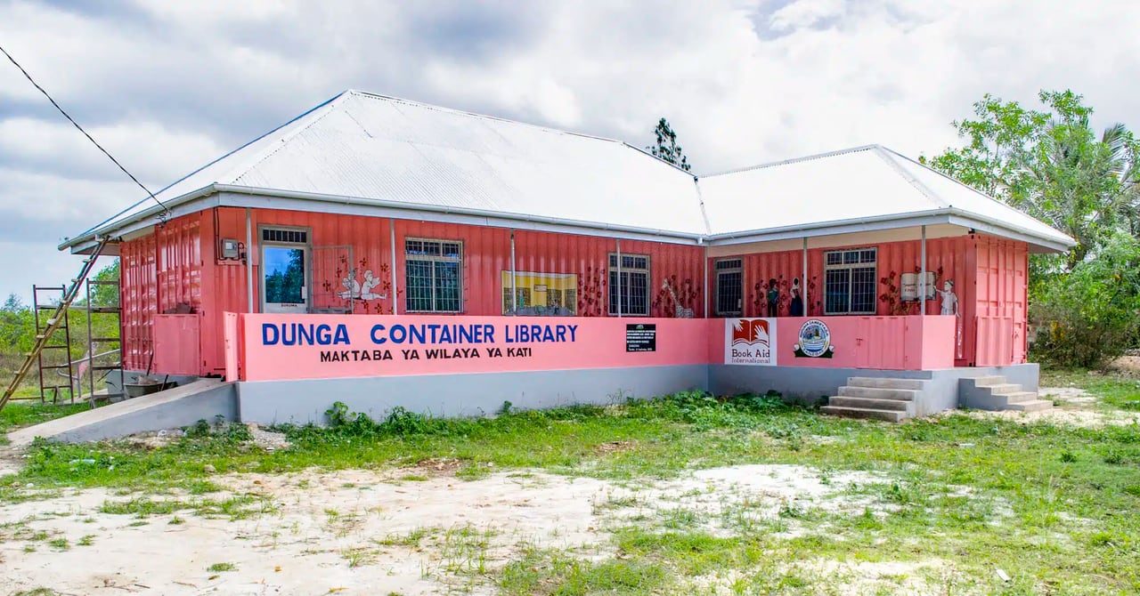 Container library in Dunga, Zanzibar, made from three 40-foot shipping containers arranged in an L-shape, painted pink