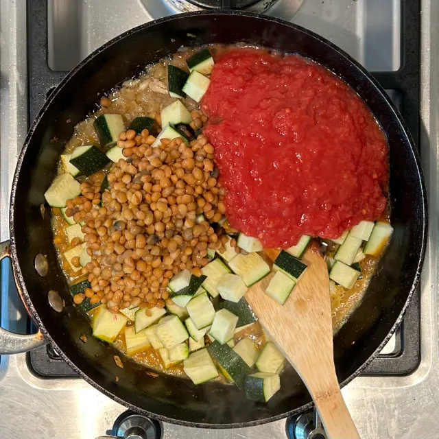 After adding tinned mackerel, tinned tomato, and tinned lentils