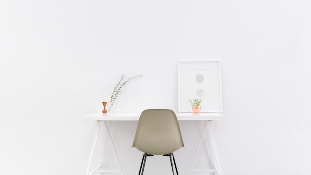 Whitespace - a white desk against a bit white wall
